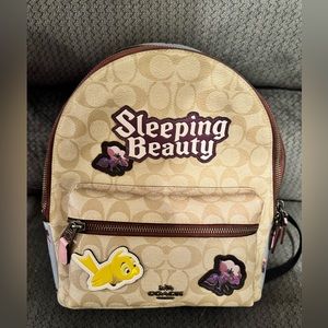 Sleeping beauty coach backpack